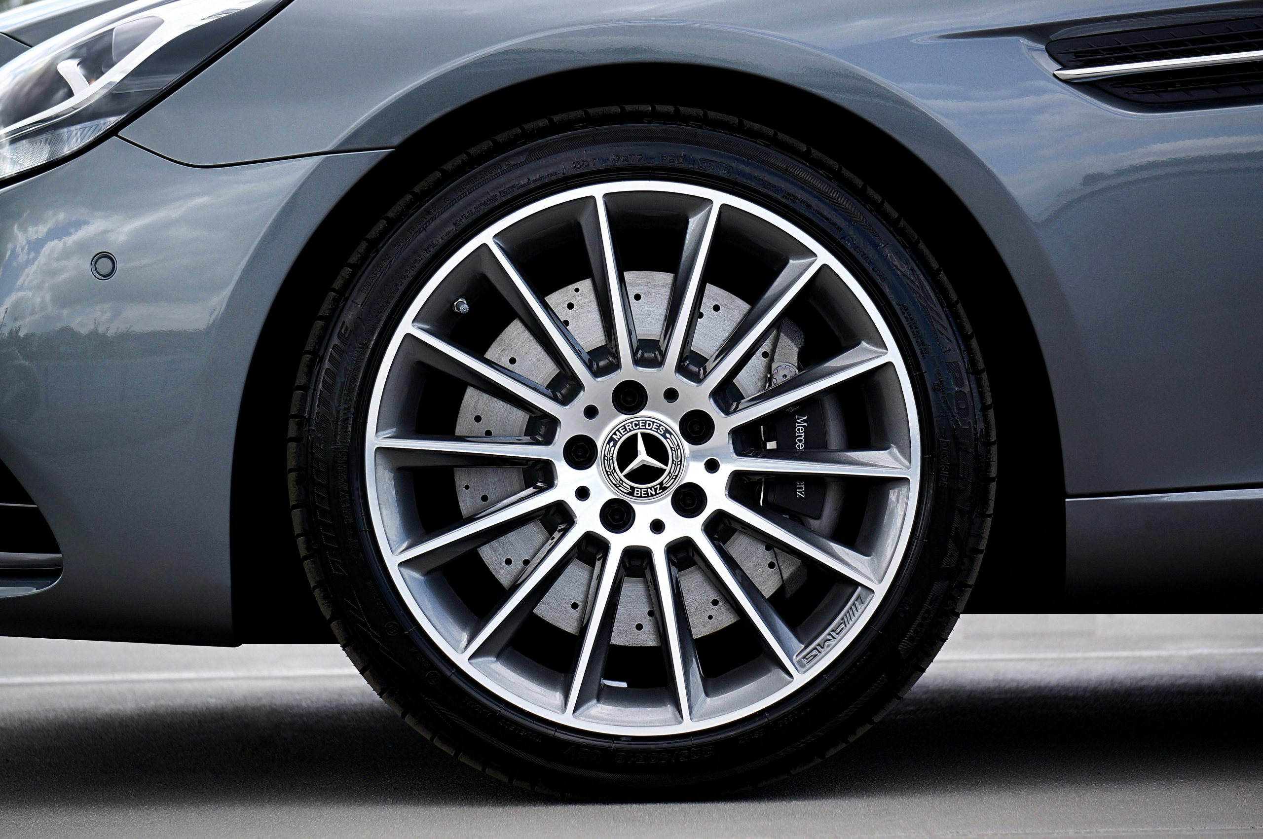 Detailed view of a Mercedes-Benz car tire and alloy wheel. Premium automotive design.